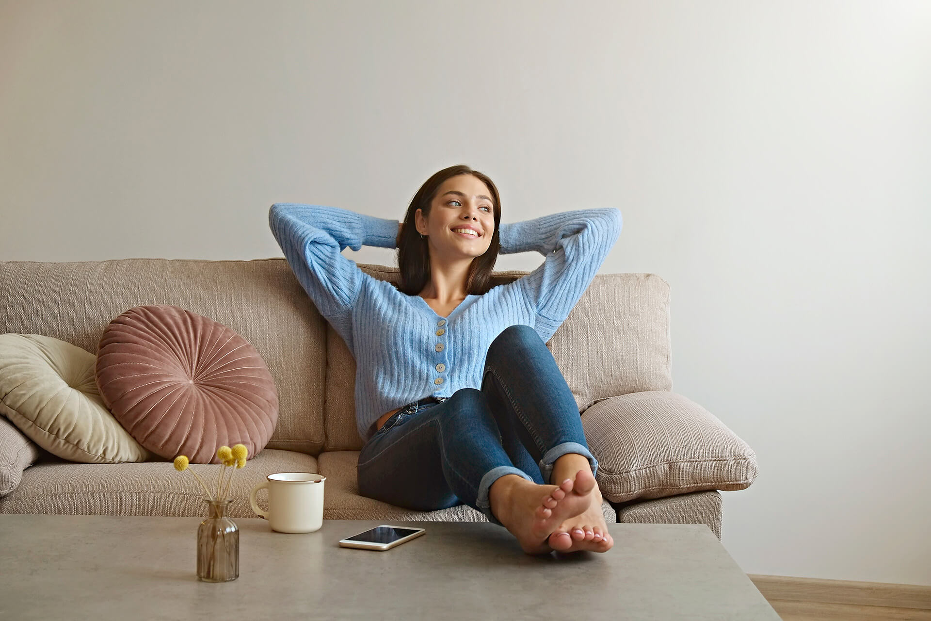 Image showing a woman relaxing on her couch