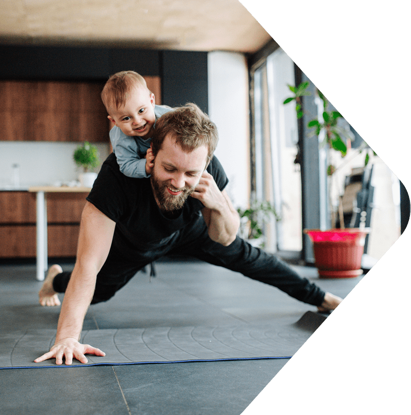 Image showing a Dad working out with a baby on his back