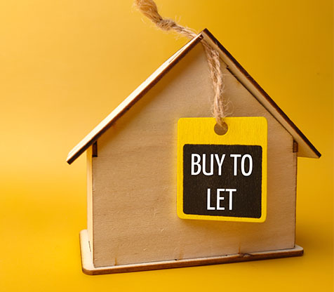 Image showing a model house with a "Buy to let" sign on it